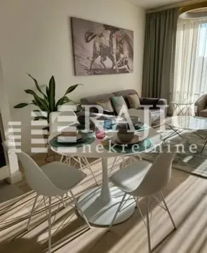 Living room with a dining table and sofa set. - image 15