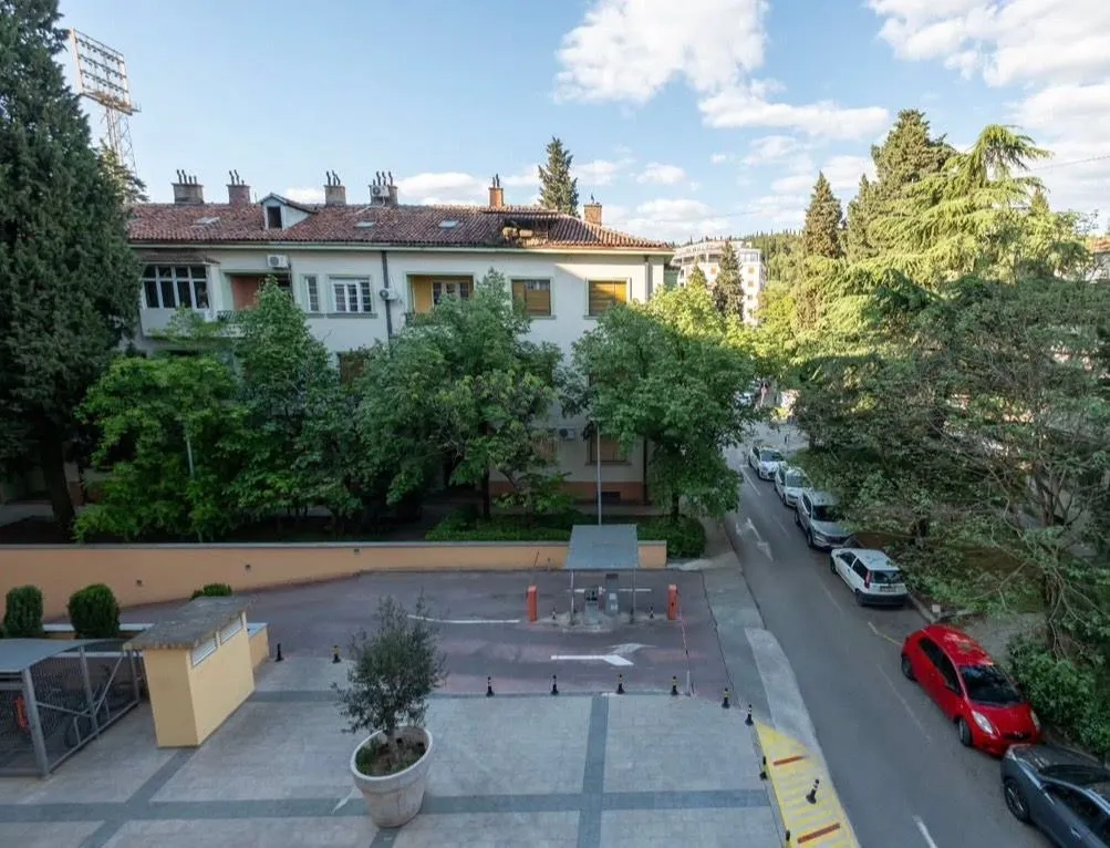 View from the terrace overlooking the building and surrounding greenery.