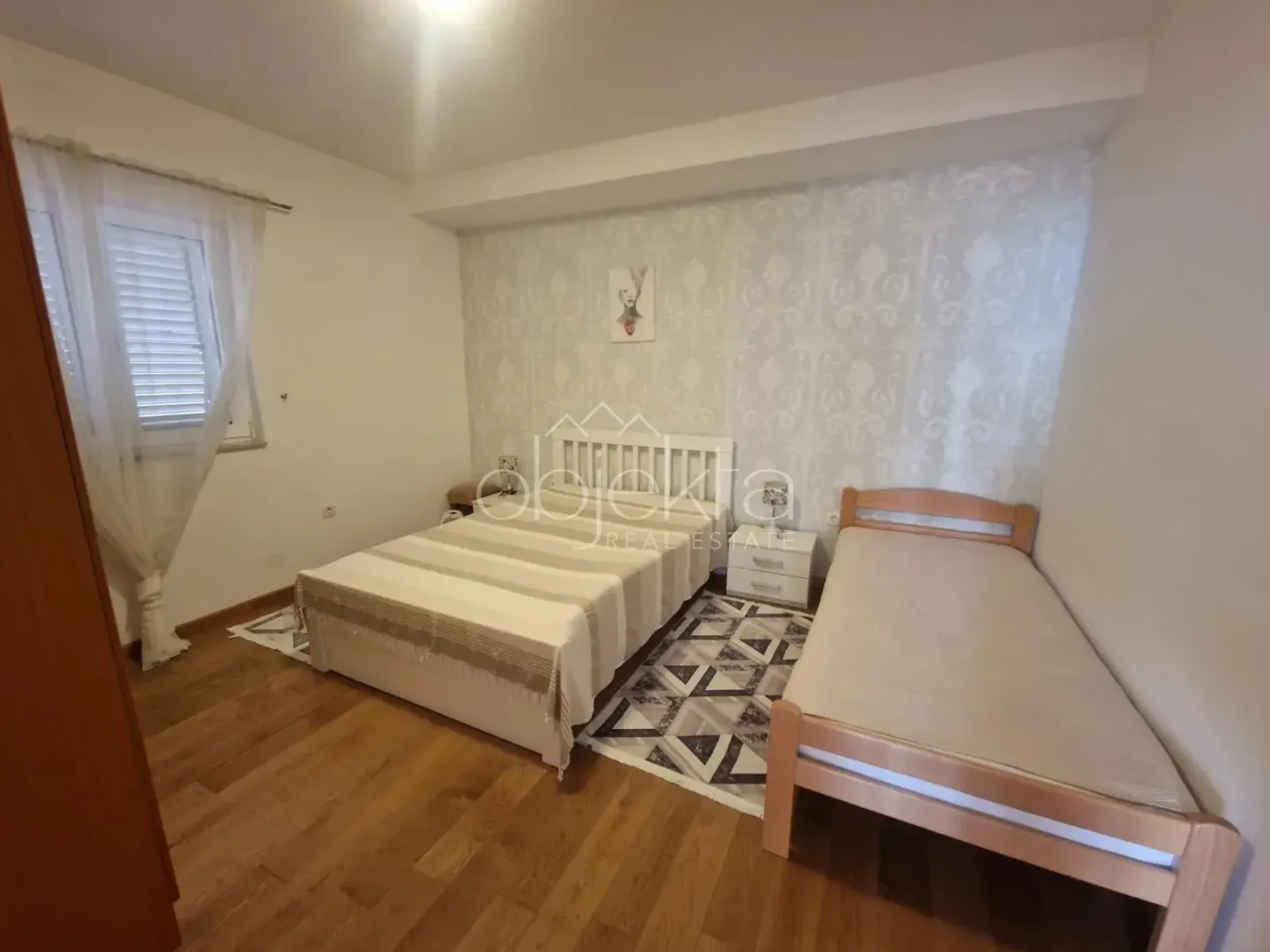 Bedroom with a double bed and an additional single bed.