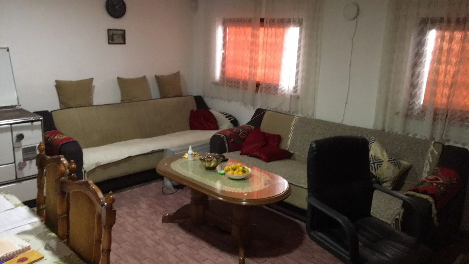 A living room with a seating set and a coffee table.