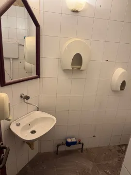 Smaller bathroom with a washbasin and white tiles. - image 4