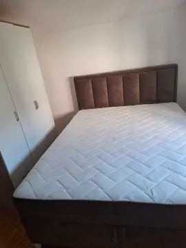 Bedroom with a double bed and a wardrobe. - image 5
