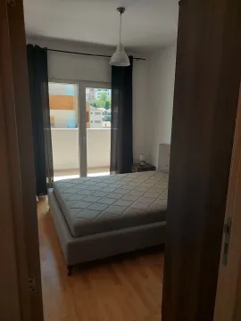 Furnished bedroom with a double bed and access to the terrace. - image 10