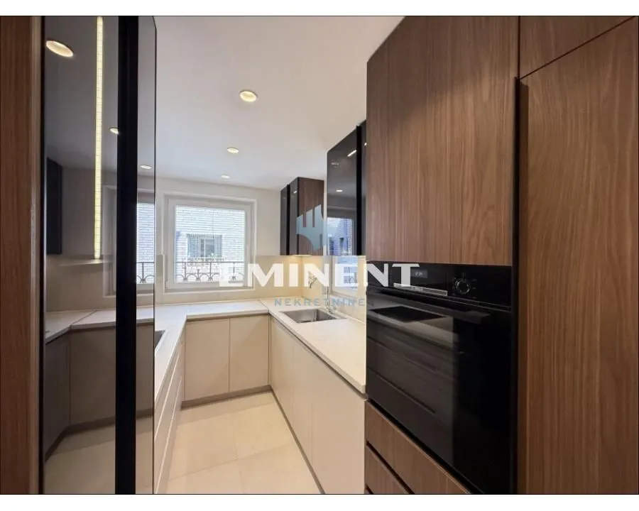 Modern fitted kitchen with wooden elements.