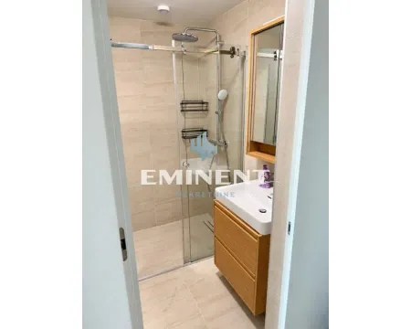 Modernly equipped bathroom with a walk-in shower and a vanity unit. - image 5