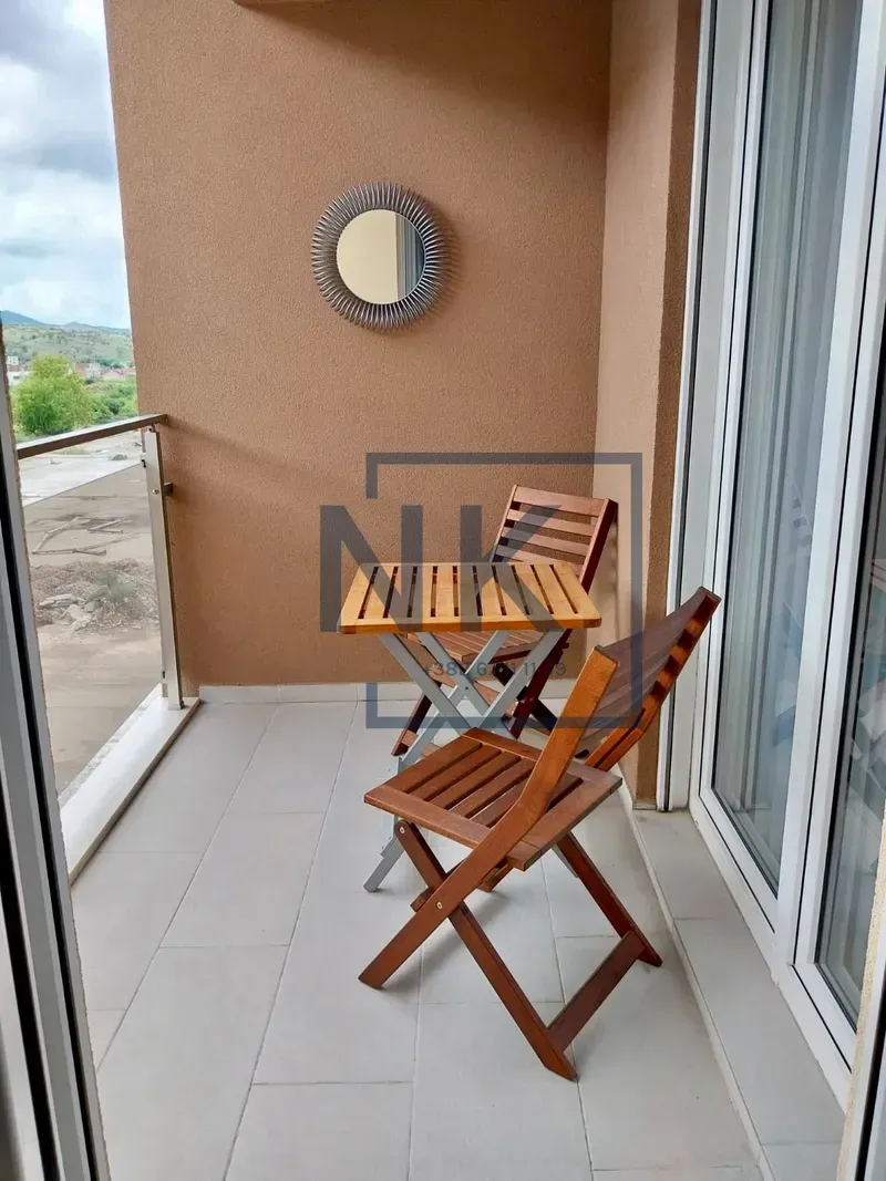 Unfurnished balcony with outdoor seating and a view of the surroundings.
