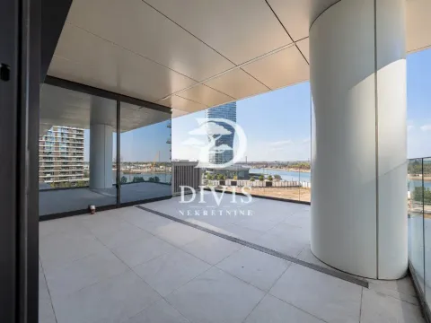 Spacious covered terrace with a view of the river and surrounding buildings. - image 17