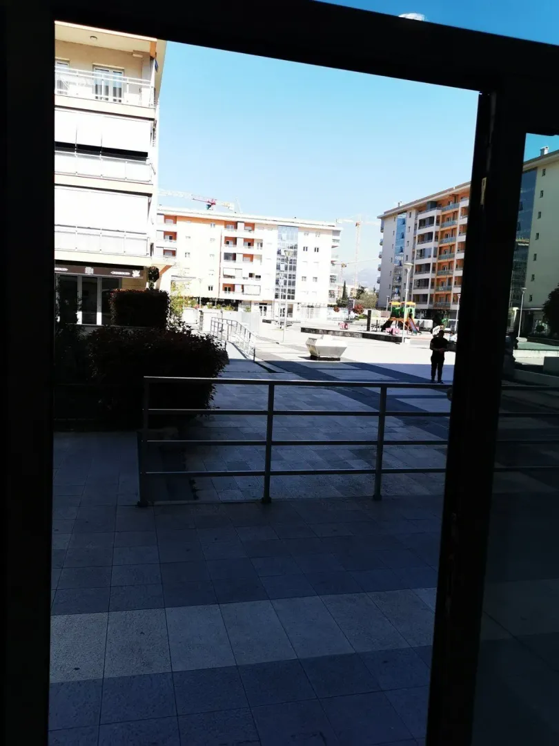 View of the paved plaza and residential buildings.