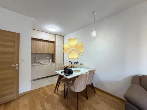 Modern kitchen with dining area and built-in units. - image 4