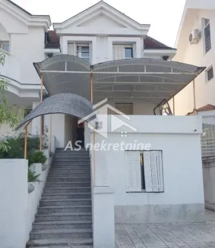 Exterior of the house with stairs and a covered terrace. - image 11