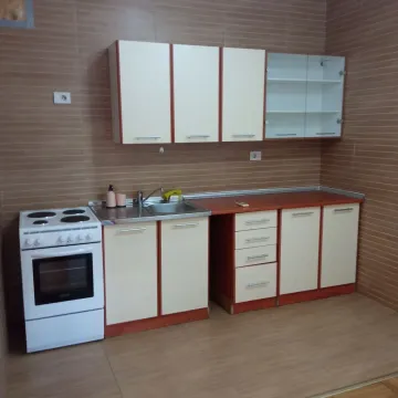 Kitchen with white cabinets and an electric stove. - image 4