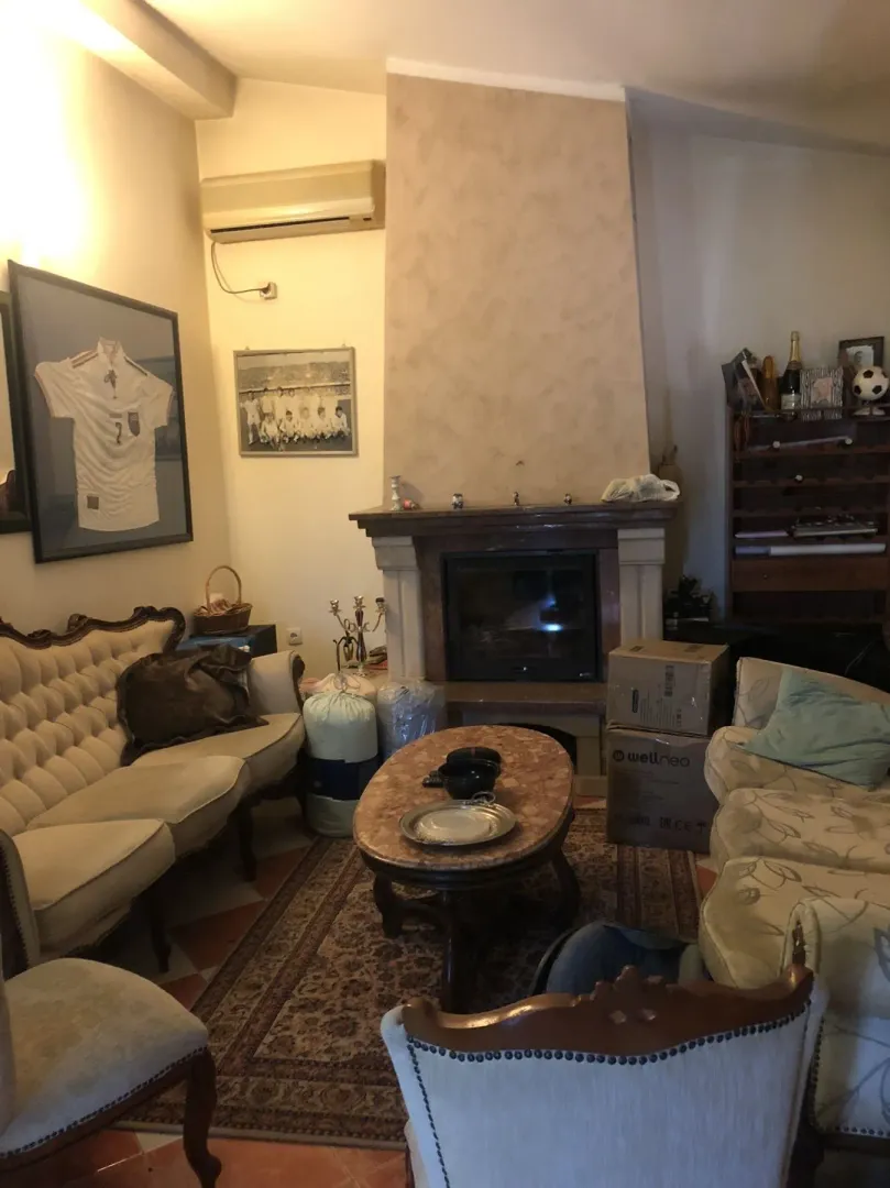 Living room with a fireplace, seating area, and a coffee table.