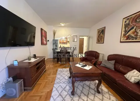 Spacious living room with a sofa set and a dining area in the background. - image 7