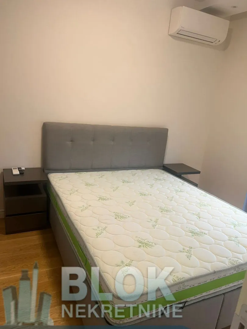 Bedroom with a double bed and nightstands.