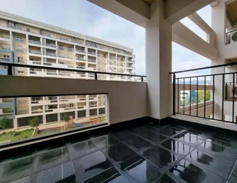 Spacious covered terrace with dark tiles and a view of neighboring buildings. - image 7