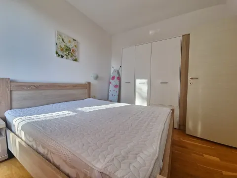 Bedroom with a double bed, wardrobe, and wooden flooring. - image 8