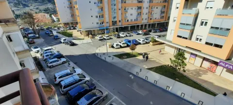 View from the terrace overlooking the street and parking lot in front of the building. - image 11