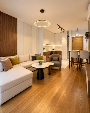 Modern open-plan living room with dining area and kitchen. - image 3