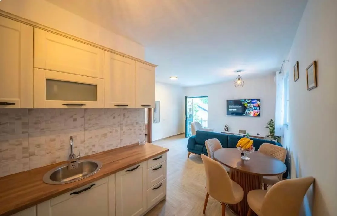 Open plan space featuring a kitchen, dining area, and living room.