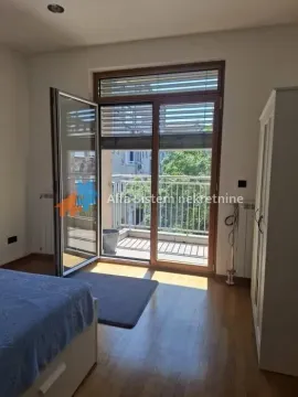 Bedroom with a double bed and access to the terrace. - image 4