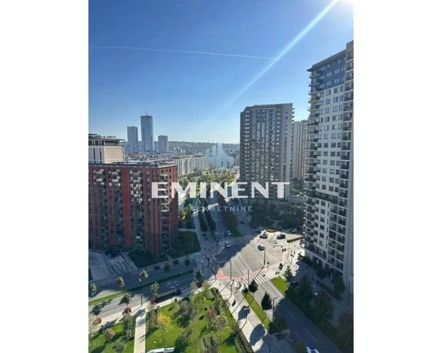 View from the window overlooking surrounding buildings and the cityscape.