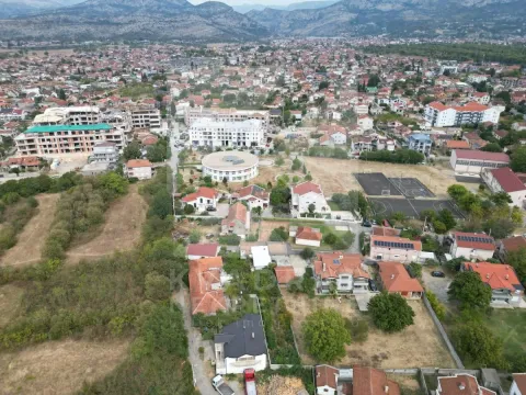 Aerial view of the urban settlement and surrounding mountains. - image 6