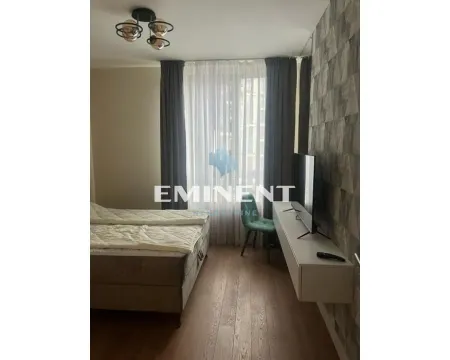 Furnished bedroom with a double bed, TV shelf and access to the terrace. - image 7