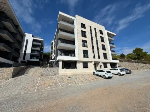 Modern residential building with arranged parking and driveway. - image 20