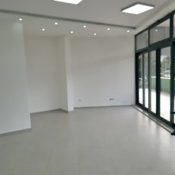 Bright empty room with large glass doors. - image 7