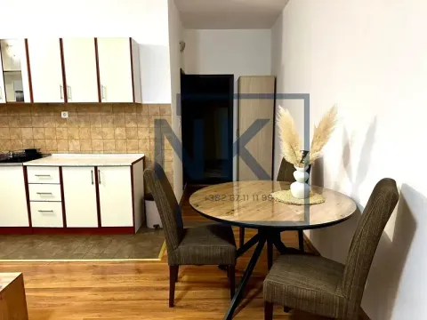 Kitchen with a dining table and chairs. - image 4