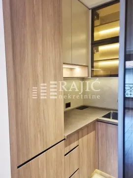 View of a modern kitchen space with wooden elements. - image 17