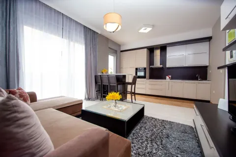 Spacious living room connected to the dining area and modern kitchen. - image 9