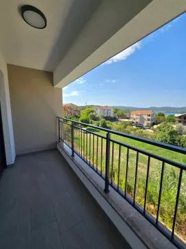 Covered balcony with a view of the surroundings and greenery. - image 11