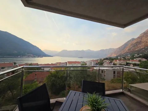 Terrace with seating furniture and a view of the sea and mountains. - image 19