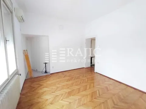 Empty room with parquet flooring and white walls. - image 9