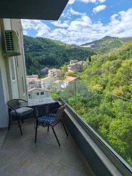 Furnished terrace with seating furniture and a view of nature and the settlement. - image 4