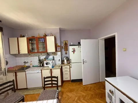 Kitchen with cabinetry and white goods. - image 7