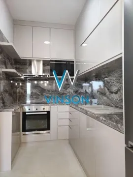 Modern U-shaped kitchen with built-in appliances and marble countertops. - image 8