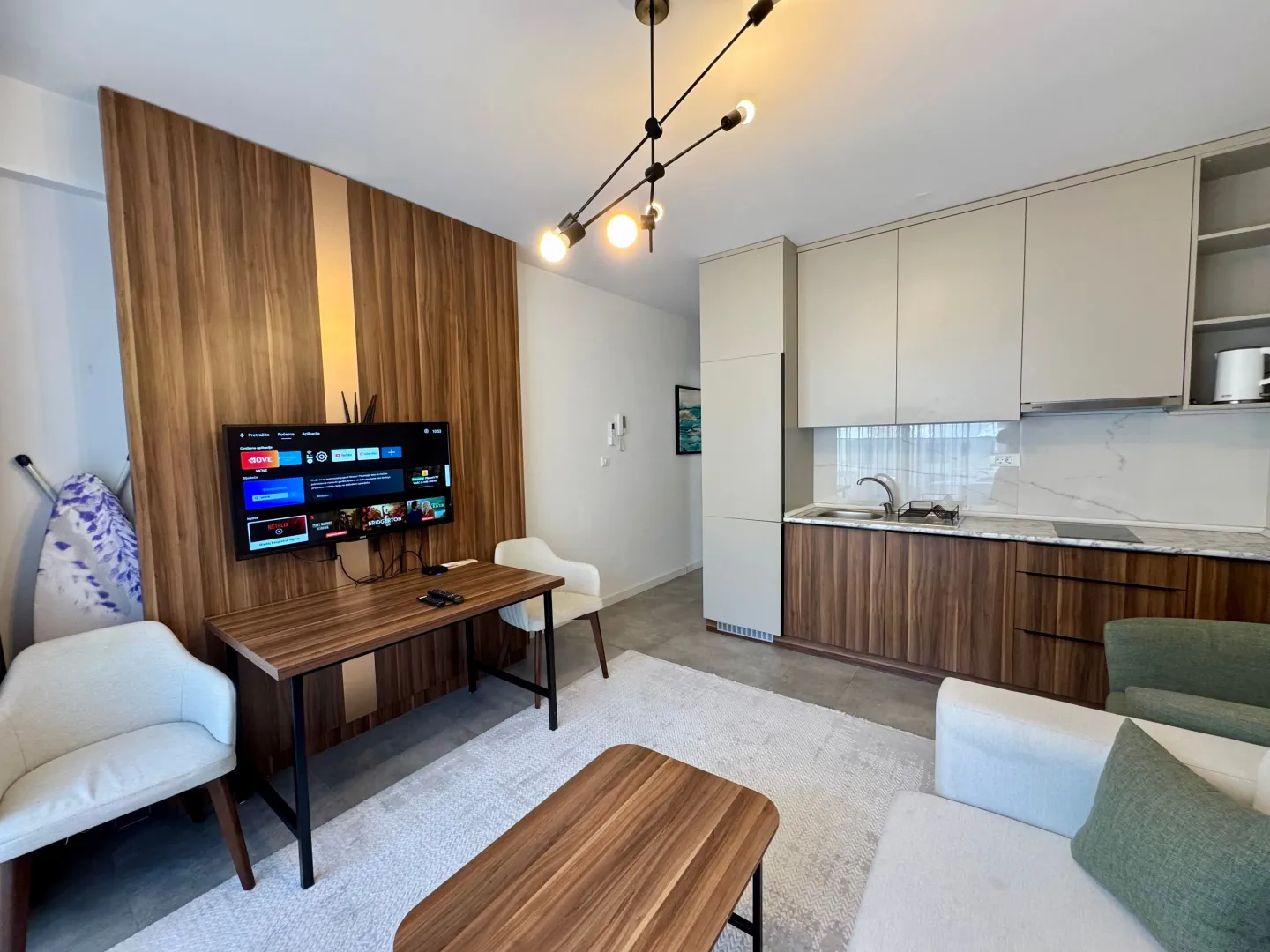 Living room with kitchen and dining table.