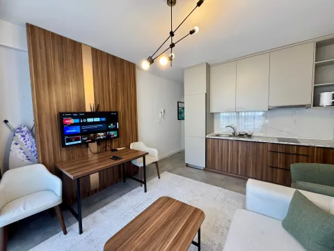 Living room with kitchen and dining table. - image 3