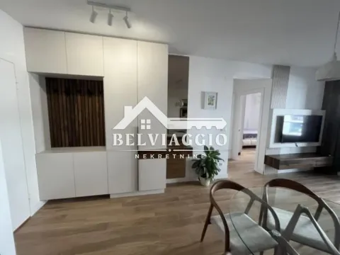 Living room with dining area and built-in wardrobes. - image 5