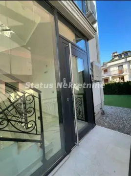 Building entrance with glass doors and stairs. - image 4