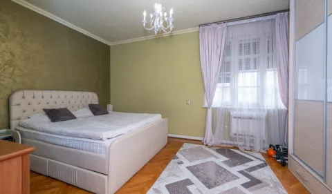 Furnished bedroom with a double bed, wardrobe, and a window. - image 4