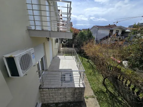 View from the balcony overlooking the yard and surrounding houses. - image 18