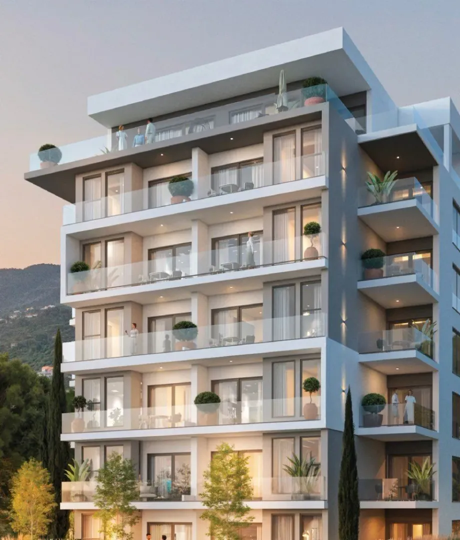 Exterior view of a modern multi-story residential building with balconies.