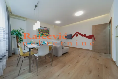 Living room with dining area and sofa. - image 2