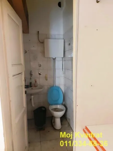 Small bathroom with toilet and sink.