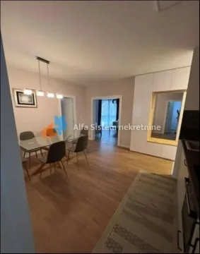 View from the kitchen towards the dining area and hallway leading to other rooms. - image 4