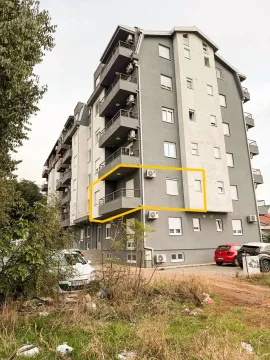 Exterior view of an apartment building with a highlighted section. - image 6