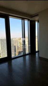 Empty room with large windows and city view. - image 9